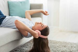 Teen Girl Listening to Music to Cope with Her ADHD and Lying Behaviors