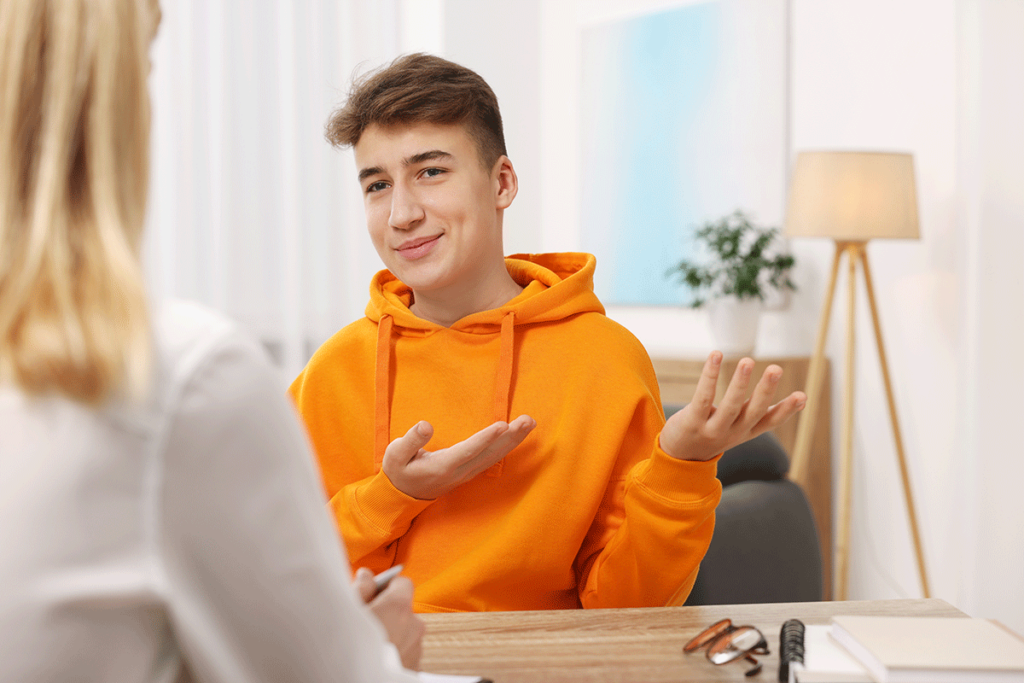 Therapist discussing the benefits of teen therapy
