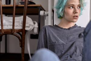 Teen with blue hair thinking about social anxiety in teens