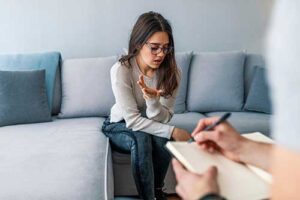 Therapist takes notes during teen depression treatment