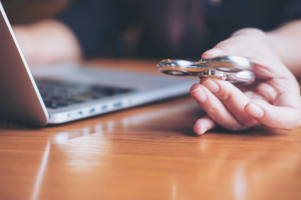 Teenager struggling with academic stress, a common sign of mental health challenges.