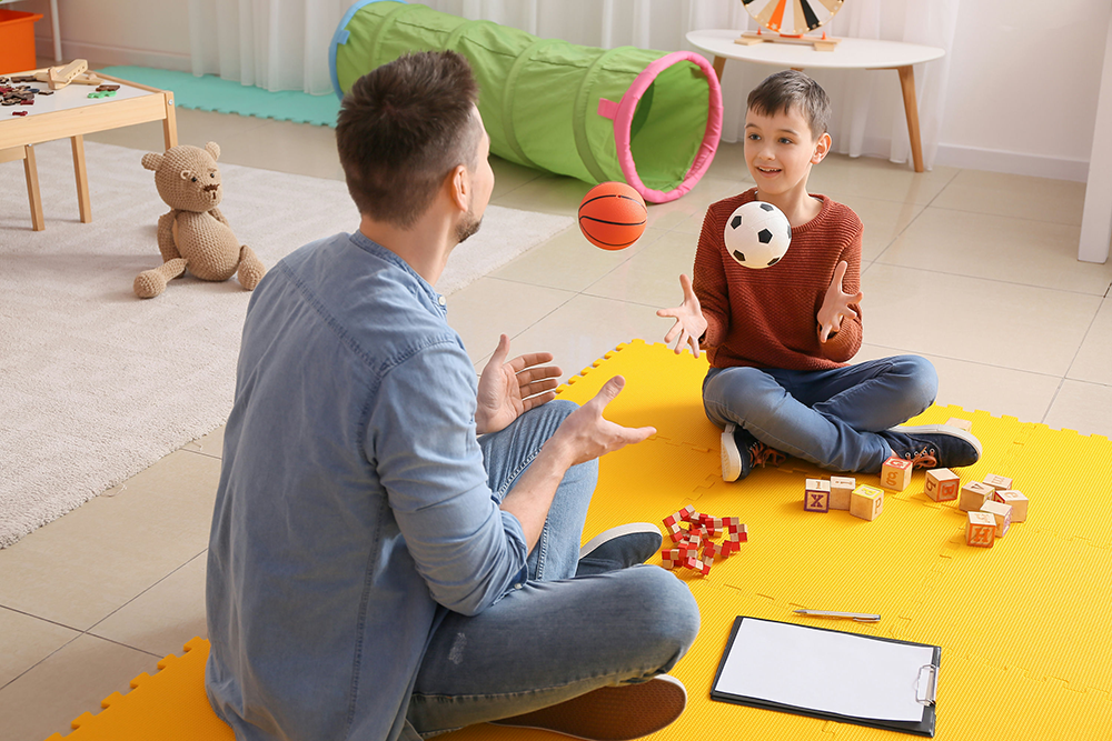 Play therapy session supporting a child with PANDAS disorder through behavioral treatment.