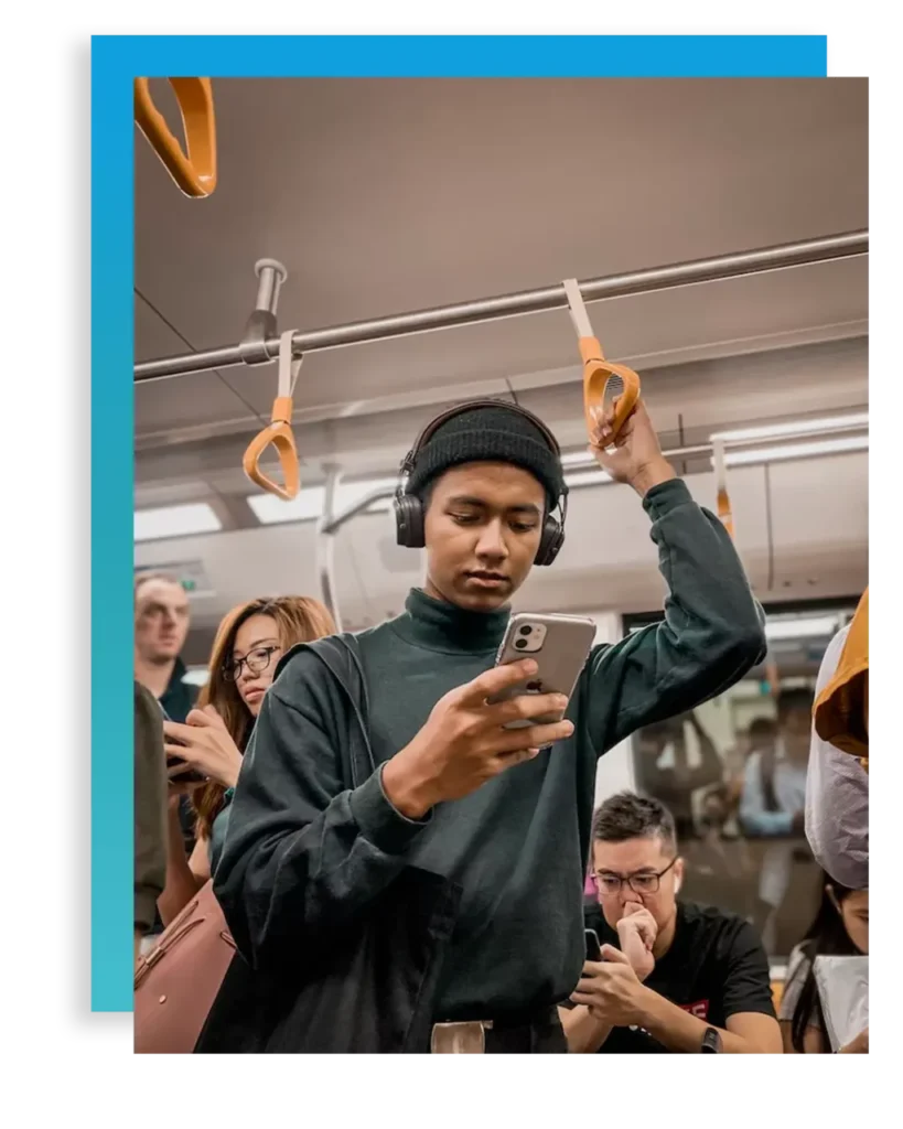 Young man on train struggling with technology addiction